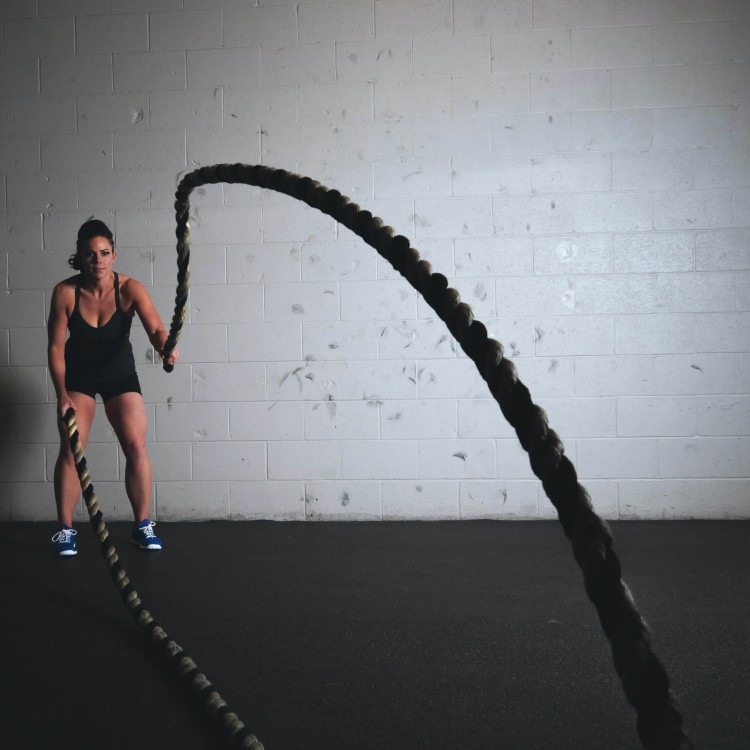 Woman exercises with a rope.